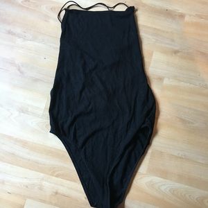black bodysuit with criss cross back detail